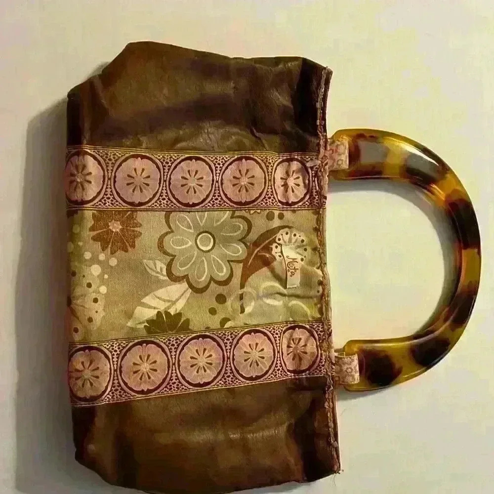 Meta handbag, brown with floral print​